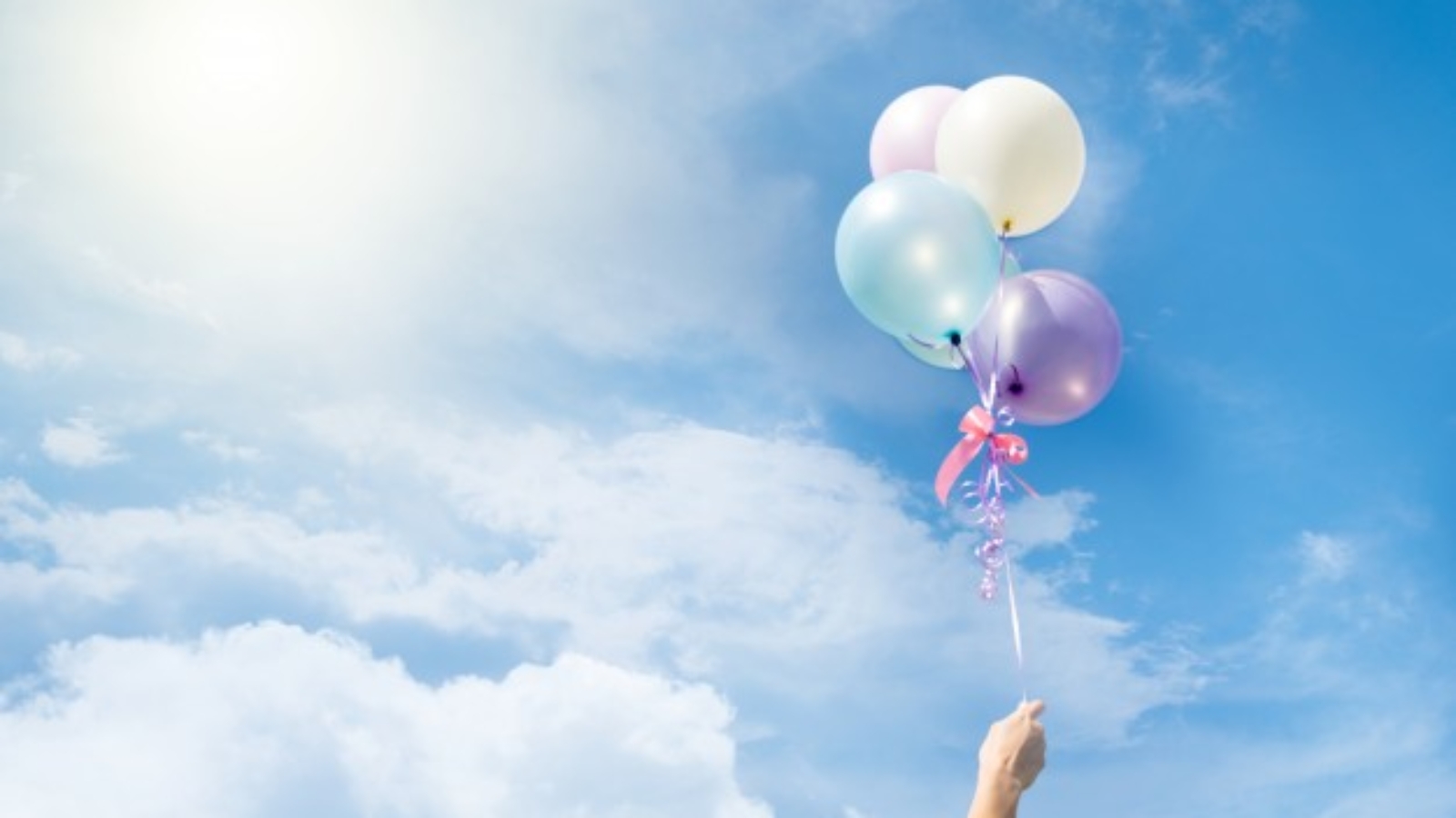 colorful-balloons-flying-on-sky_1421-182